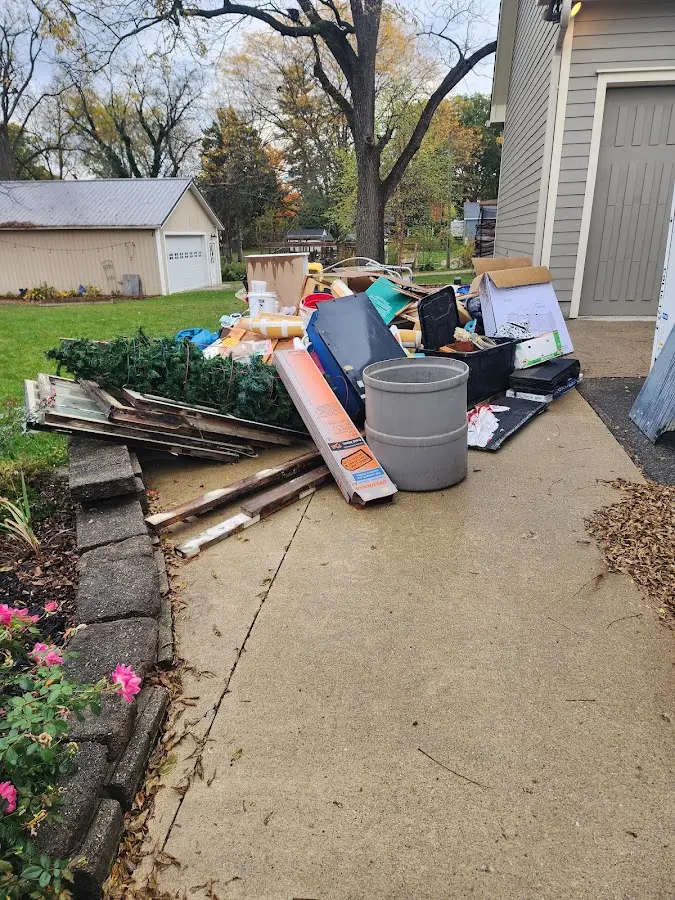 Dumpster being loaded with debris for Roofing Dumpster Rental in Germantown Hills